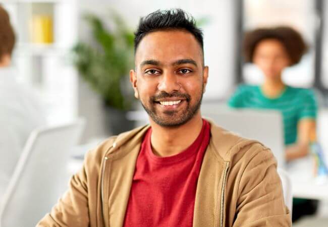 Smiling indian man after gfc hair therapy
